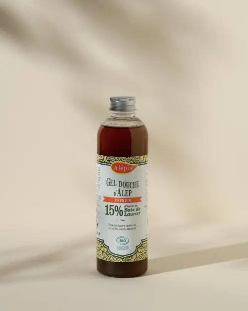 Gel de ducha de Alepo Premium 15% Laurel Alepia en frasco transparente con tapón metálico plateado